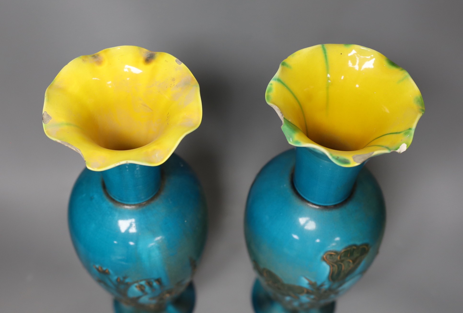 A pair of Linthorpe turquoise glazed pottery vases, impressed model no 2219, incised mark AS. 36cm high